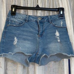 Ripped blue jean shorts